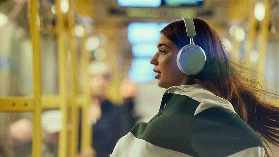 Beyerdynamic Aventho Y in Soft Jade worn on a tram