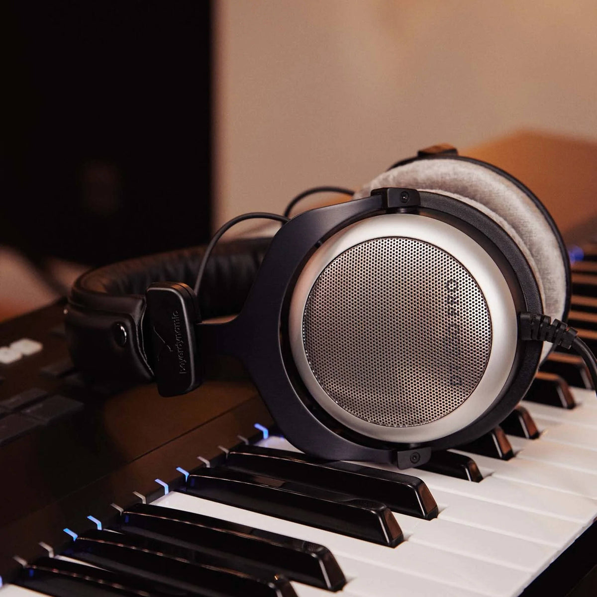 Beyerdynamic DT 880 Pro studio headphones with 250 ohm impedance, featuring over-ear design and professional audio quality.
