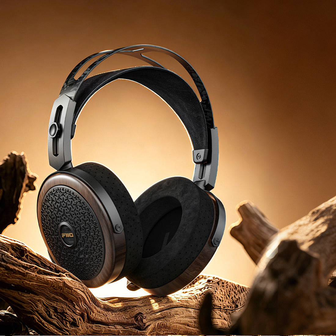 FiiO FT15 headphones with black walnut earcups on driftwood