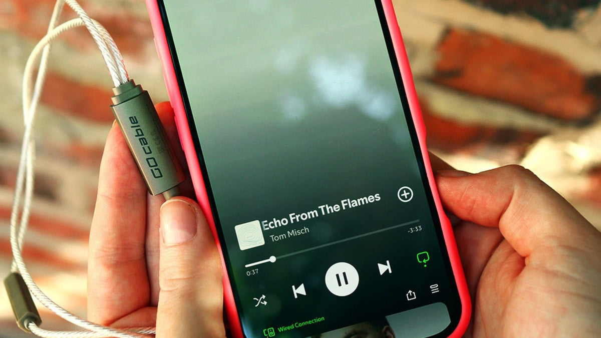 iFi Audio GO cable USB-C plug connected to a smartphone in hand