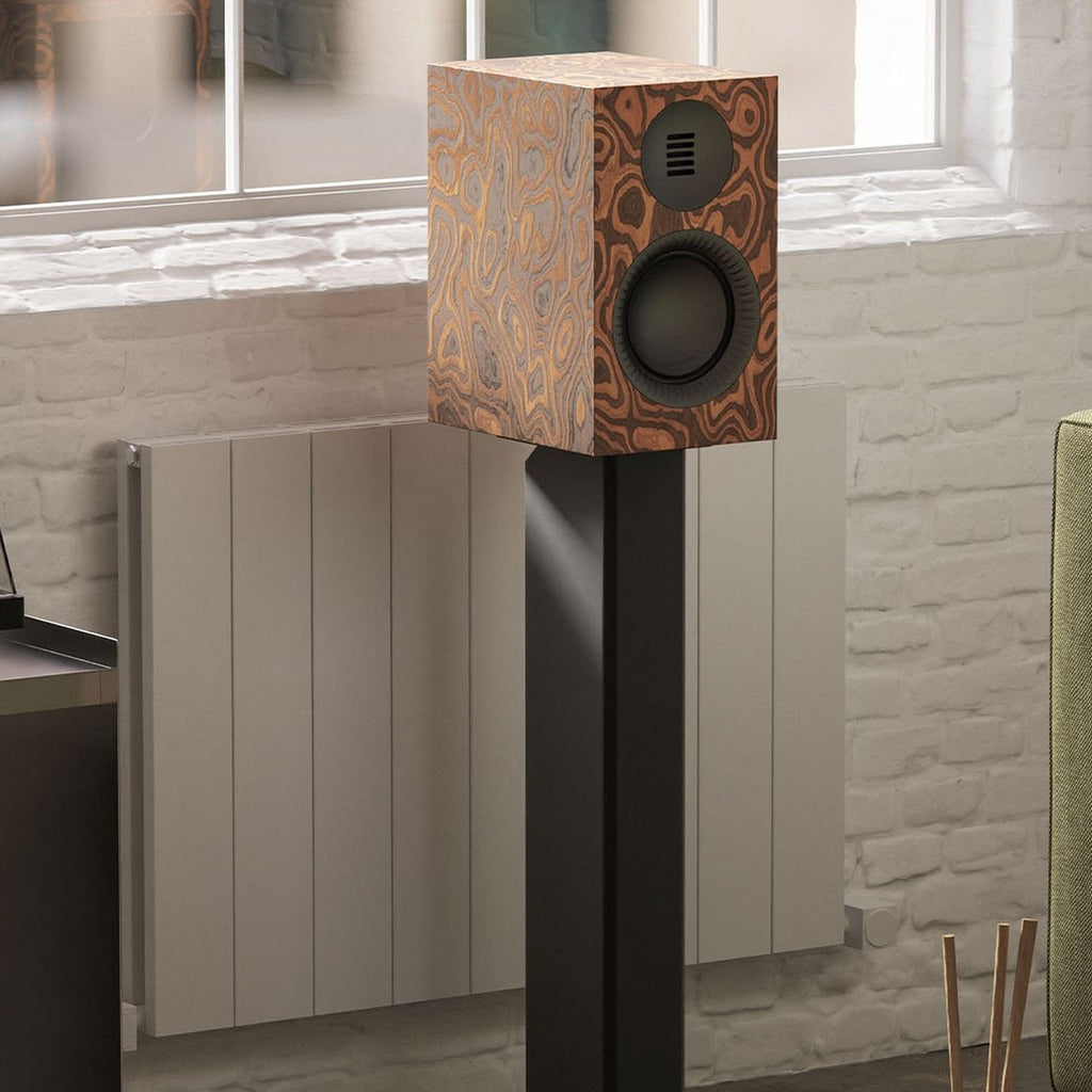 Kanto Audio TUK G2 in Matte Burl on a speaker stand in a living room next to a turntable