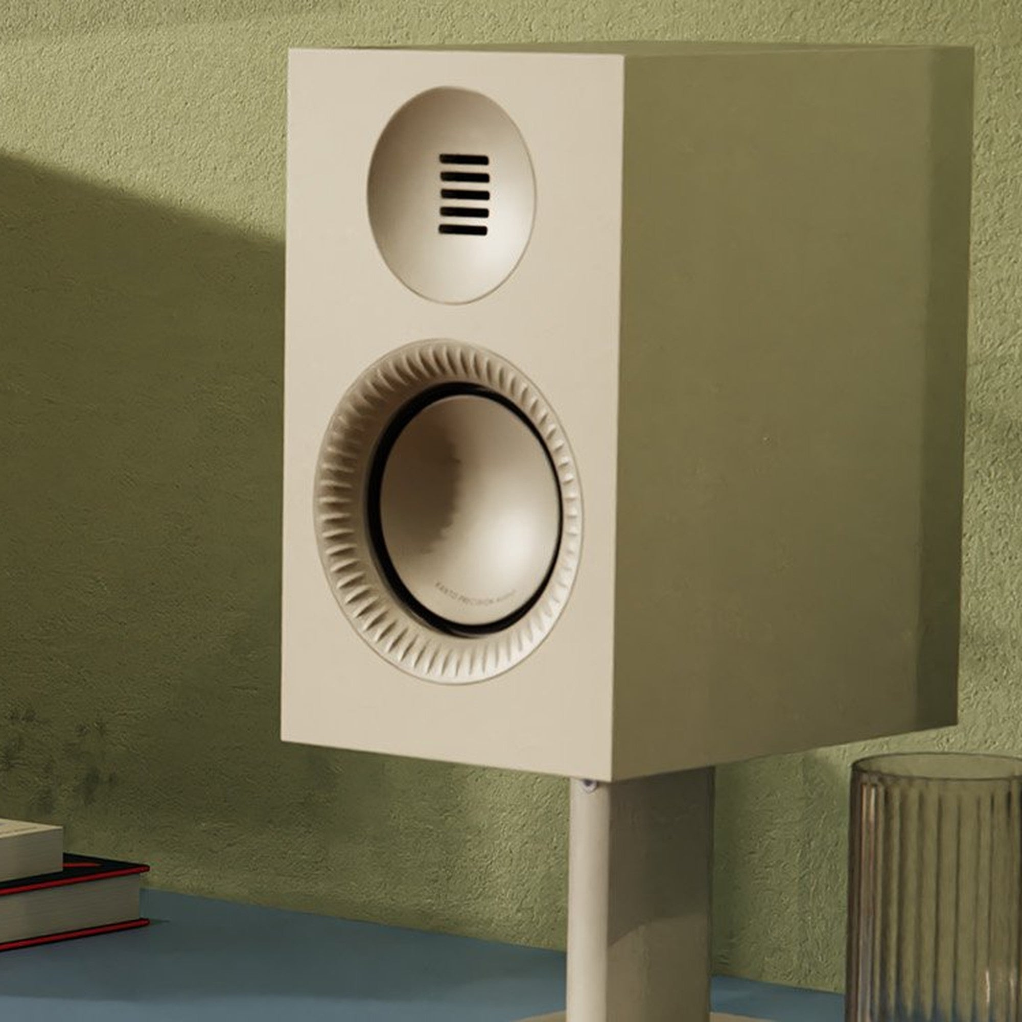 Kanto Audio TUK G2 in Matte White on a sideboard with desktop stands against a green wall