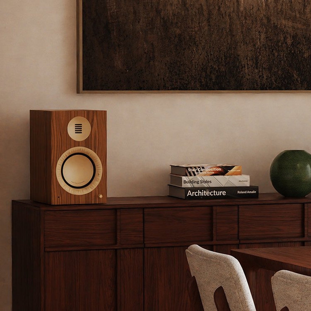 Kanto Audio TUK Grand in Matte Walnut on a wooden credenza in a dining room
