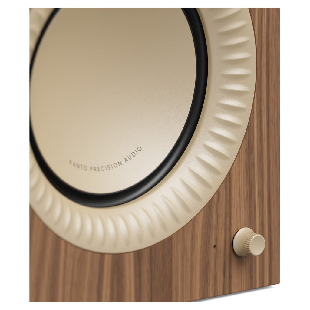Kanto Audio TUK Grand Matte Walnut cabinet with rose gold woofer surround, close-up