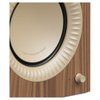 Kanto Audio TUK Grand Matte Walnut cabinet with rose gold woofer surround, close-up