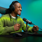 Shure MV6 Gen 2 Black, on a gaming desk with laptop
