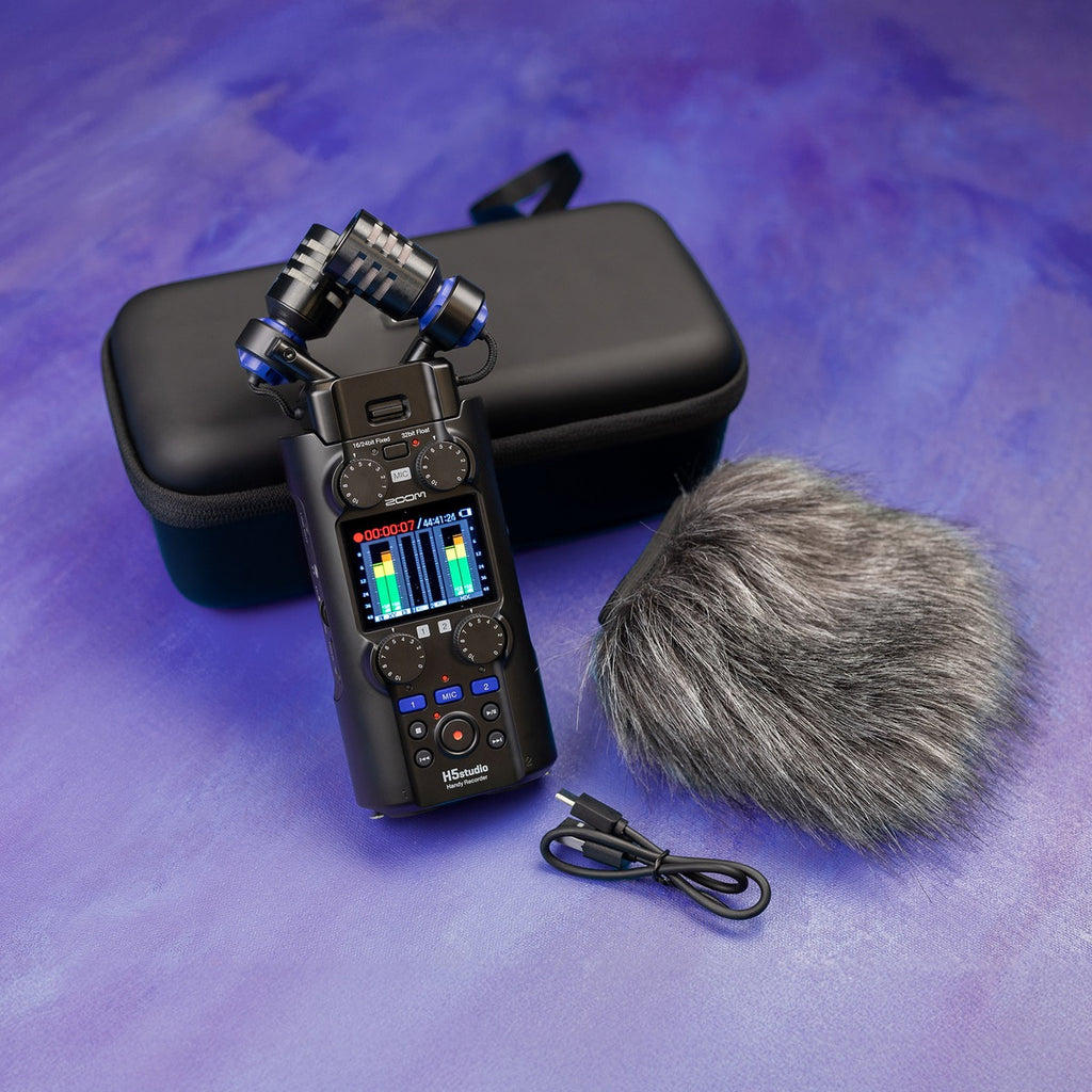 Zoom WSH-5s recorder accessory in a lifestyle setting, showing its compact design and portable features for audio recording.
